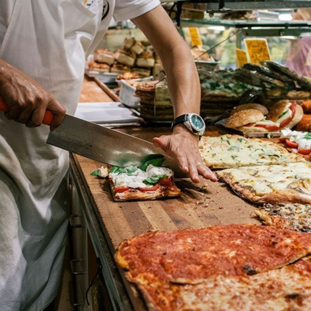 A restaurant serving authentic italian pinsa pizzas to its customers